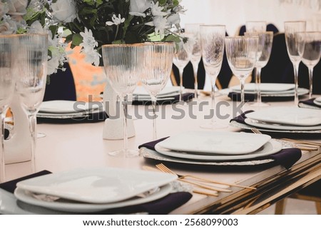 Wedding table setup with glasses for guests 