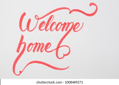 Welcome Home Creative Brush Lettering On White Background With Copy Space