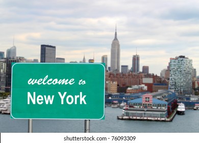  Welcome to New York sign with famous skyline and boat docks along the Hudson River