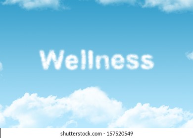 wellness - cloud word on blue sky background