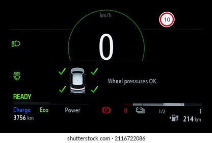 Wheel Pressures Indicator On Car Dashboard. TPMS (Tyre Pressure Monitoring System) On Panel. Checking Tires Pressures. Car Cluster In EV Full Electric Car