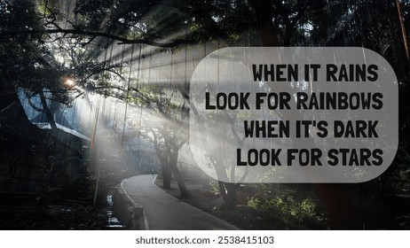 When it rains look for rainbows when it's dark look for star. Powerful quote encourages us to keep our focus on the positive aspects of life. Sun beam through the green foliage natural background.  - Powered by Shutterstock