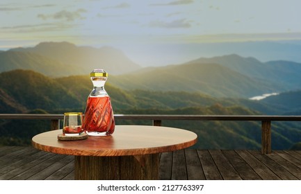 Whiskey or brandy in a clear bottle with a spiral design and a clear glass placed on tree bark or tree bark. Landscape with pine and mountain scenery in the morning. The sun is rising. 3D Rendering - Powered by Shutterstock