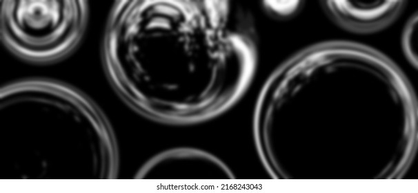 White abstract blurry bubbles on black background