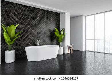 White Bath Against Black Tile Wall In A Big Bathroom With Plants, Large Window With City View. Stylish Minimalist Bathroom, No People 3D Rendering