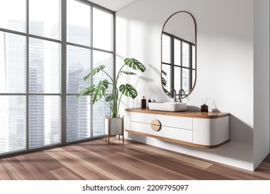 White Bathroom Interior With Sink And Oval Mirror, Side View, Big Plant In The Corner On Hardwood Floor. Panoramic Window On Singapore Skyscrapers. 3D Rendering