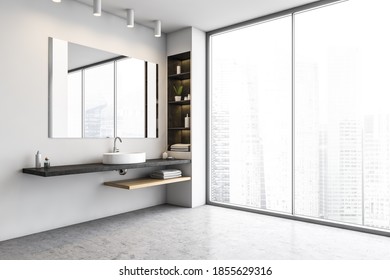 White Bathroom, Sink And Big Mirror With Shelves. Open Space Bathroom With Grey Floor And A Big Window With View On Skyscrapers, 3D Rendering No People