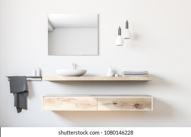 White bathroom sink standing on a wooden shelf. A square mirror hanging on a white wall. 3d rendering