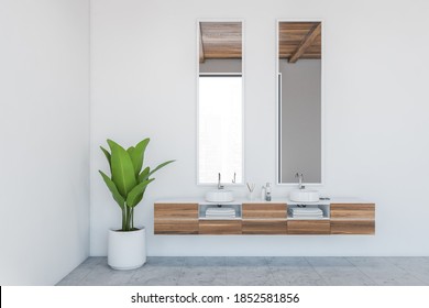 White Bathroom With Two Sinks And Wooden Drawers With White Towels Inside. White Room With Two Washbasins And Plant, 3D Rendering No People