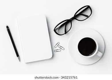 White blank diary cover, cup of coffee and glasses on white table, mock up 3D Render