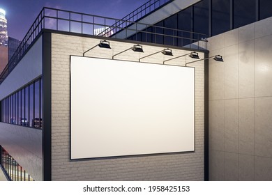 White Blank Outdoor Billboard And Lighting Backlights On White Brick Wall Of Business Center Building At Night. 3D Rendering, Mock Up