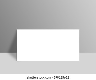 White Blank Stationary Near The Grey Wall With Shadow. Close Up Magazine, Book, Brochure, Flyer, A4 Letterhead, Folder, Leaflet, Booklet