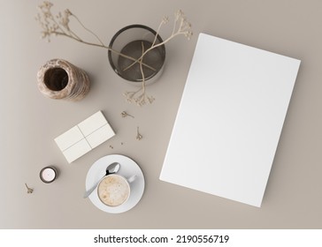 White Book Cover Mock Up With Coffee Cup, Vase And Other Home Accessories On Beige Table. Blank Template For Your Design. Top View, Close-up. Book, Catalogue Or Magazine Cover Presentation. 3D Render