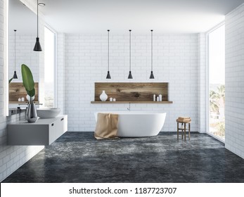 White brick bathroom interior with a concrete floor, a white bathtub, a round sink, several ceiling lamps and a wooden shelf with candles. 3d rendering