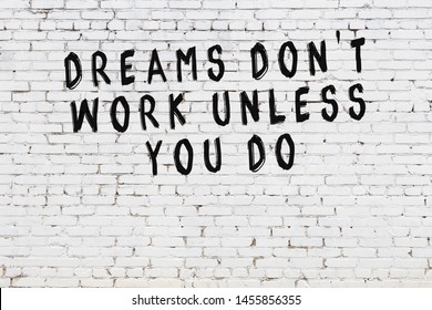 White brick wall with painted black motivational quote inscription. - Shutterstock ID 1455856355