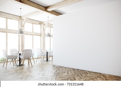 White cafe interior with tall windows, a wooden floor, gray sofas, square tables and white and wooden chairs. A blank wall, side view. 3d rendering mock up