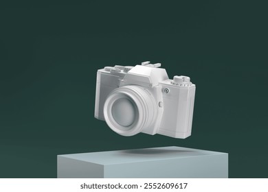 A white camera is floating in midair. The camera is a model and not a real one. The camera is placed on a green surface
