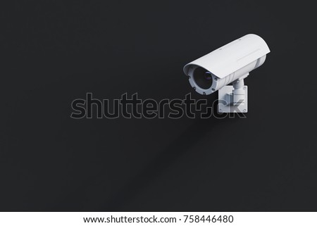 White CCTV camera attached to a blank black wall outside. Concept of security and surveillance. 3d rendering mock up