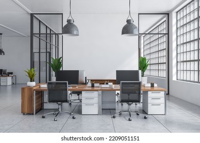 White Coworking Interior With Armchairs And Pc Computer On Desk, Light Tile Concrete Floor. Business Work Zone With Panoramic Window. Mockup Empty Wall. 3D Rendering