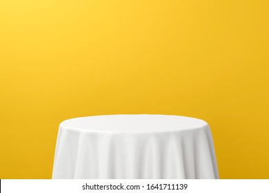 White Dinner Table Or Empty Pedestal Display On Vivid Yellow Background With Elegant Fabric. Blank Stand For Showing Product. 3D Rendering.