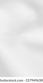 White fabric background with a smooth texture. The background is white, creating a clean and elegant appearance. Gray textured mobile phone wallpaper with copy space.