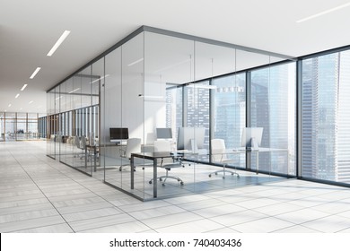 White And Glass Office Interior With A White Wooden Floor, Large Windows With A Cityscape And Computer Desk. 3d Rendering