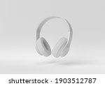 white headphone floating on white background. minimal concept idea. monochrome. 3d render.