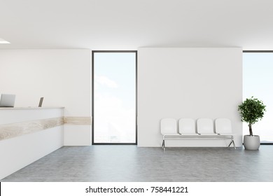 White Hospital Lobby With A Reception Desk And White Chairs For Patients Waiting For The Doctor Visit. 3d Rendering Mock Up