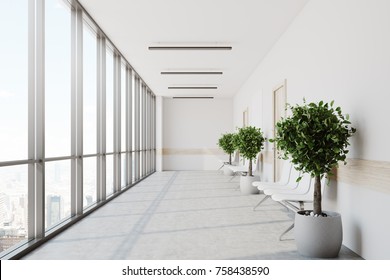 White Hospital Lobby With A Row Of Doors And White Chairs For Patients Waiting For The Doctor Visit. 3d Rendering Mock Up