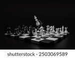 White king chess pieces destroy black king chess pieces over the chess board. Leader, plan, fight, destroy, win, lose concept.
