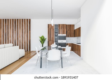 White Living Room With Eating Table And Chairs. Wooden Kitchen Set With Shelves And Oven On Background, 3D Rendering No People