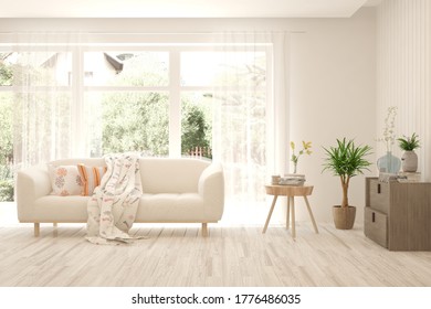 White living room with sofa and summer landscape in window. Scandinavian interior design. 3D illustration - Shutterstock ID 1776486035