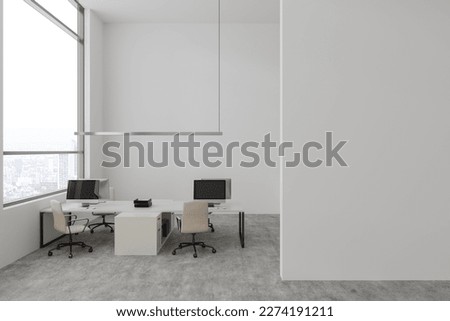 White office interior with shared table and pc computer. Coworking zone with panoramic window on skyscrapers, grey concrete floor. Mock up empty white partition. 3D rendering