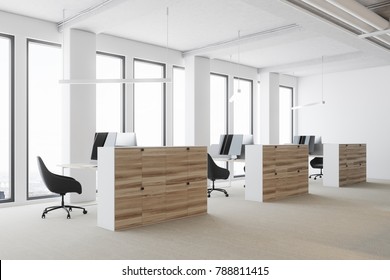 White Open Space Office Environment With A Concrete Floor, Large Windows, And Wooden Cubicles With Computer Tables. 3d Rendering Mock Up