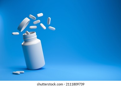 White pills from plastic medicine bottle on blue background with copy space. Medicine and health concept. 3d rendering.