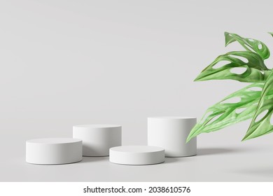 White Product Display Podium With Monstera Leaf. 3D Rendering