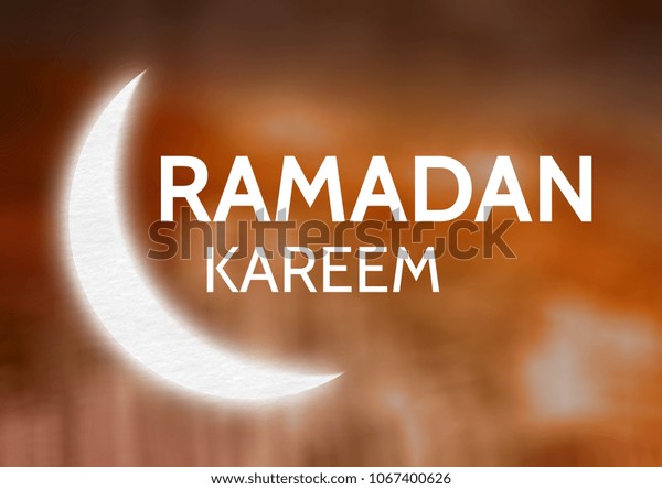 White\
Ramadan graphic against orange blurry\
background