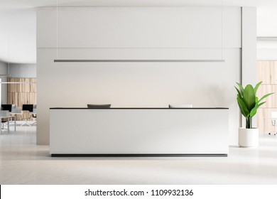 White Reception Desk With Computers Standing On A Concrete Floor Of A Modern Office. An Open Space Office Area In The Background. 3d Rendering Mock Up