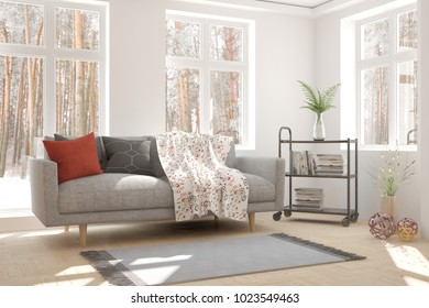 White room with sofa and winter landscape in window. Scandinavian interior design. 3D illustration - Shutterstock ID 1023549463