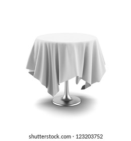 White Round Table And Cloth Isolated On A White Background