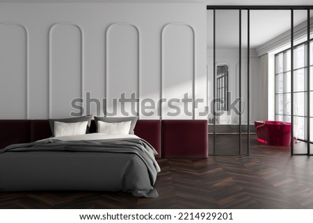 White studio interior with sleeping area, bathing area with bathtub and sink behind glass doors. Cozy hotel flat with panoramic window on skyscrapers. 3D rendering