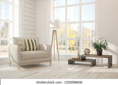 White stylish minimalist room with armchair and autumn landscape in window. Scandinavian interior design. 3D illustration - Shutterstock ID 1335008606