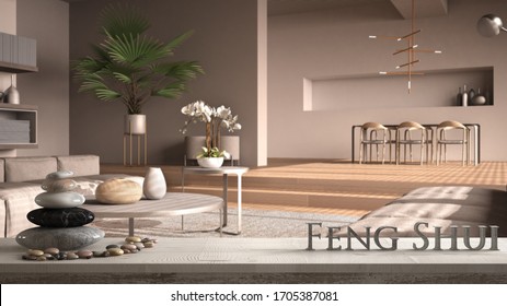 White table shelf with pebble balance and 3d letters making the word feng shui over lounge with dining room in beige tones with wooden details, zen concept interior design