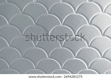 White tile in fish scale, cloud, wave style in toilet wall texture pattern mosaic light shade for background