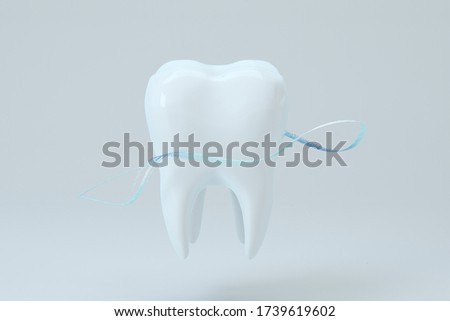 White tooth with blue gradient particles surrounded, 3d rendering. Computer digital drawing.