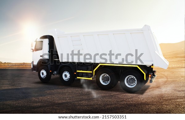 White truck tipper\
poster,\
field construction. Concept of overloading on the roads\
and renting a dump truck for work, white truck drives in the\
daytime side view, illustration\
3D