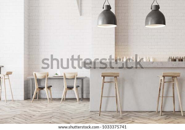 White wall bar interior with a wooden floor, a
stone bar and wooden stools near it. Tables with chairs in the
background. 3d rendering mock
up