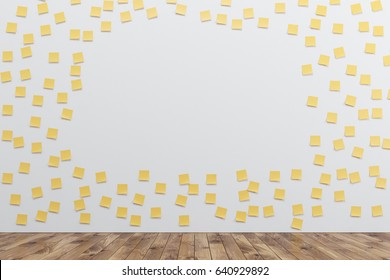 White wall is covered by many yellow sticky notes and an opening in the middle. There is a wooden floor in the room. 3d rendering, mock up - Powered by Shutterstock