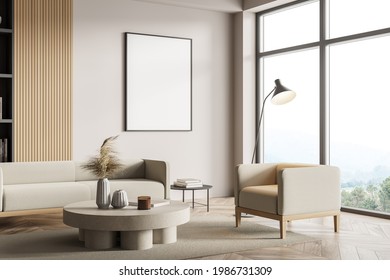 White walls living room, office lounge or home library corner. Comfortable sofa, armchair, coffee table and bookcase. Vertical mock up poster frame and window with blurry mountain view. 3d rendering