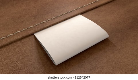 A White Woven Clothing Label Sewn Into Seamed Brown Leather